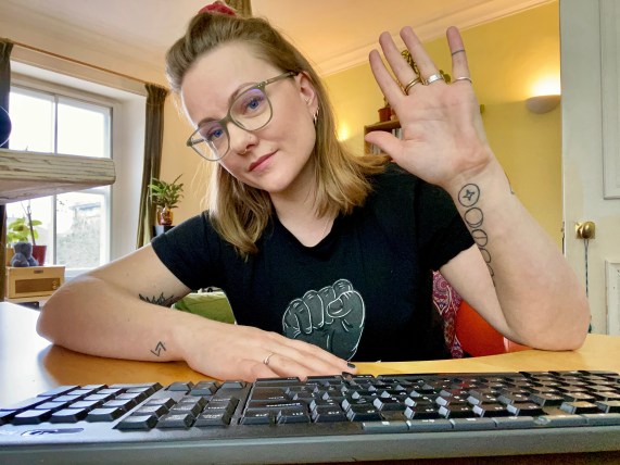 Becky C IWD Hand up at desk Pic